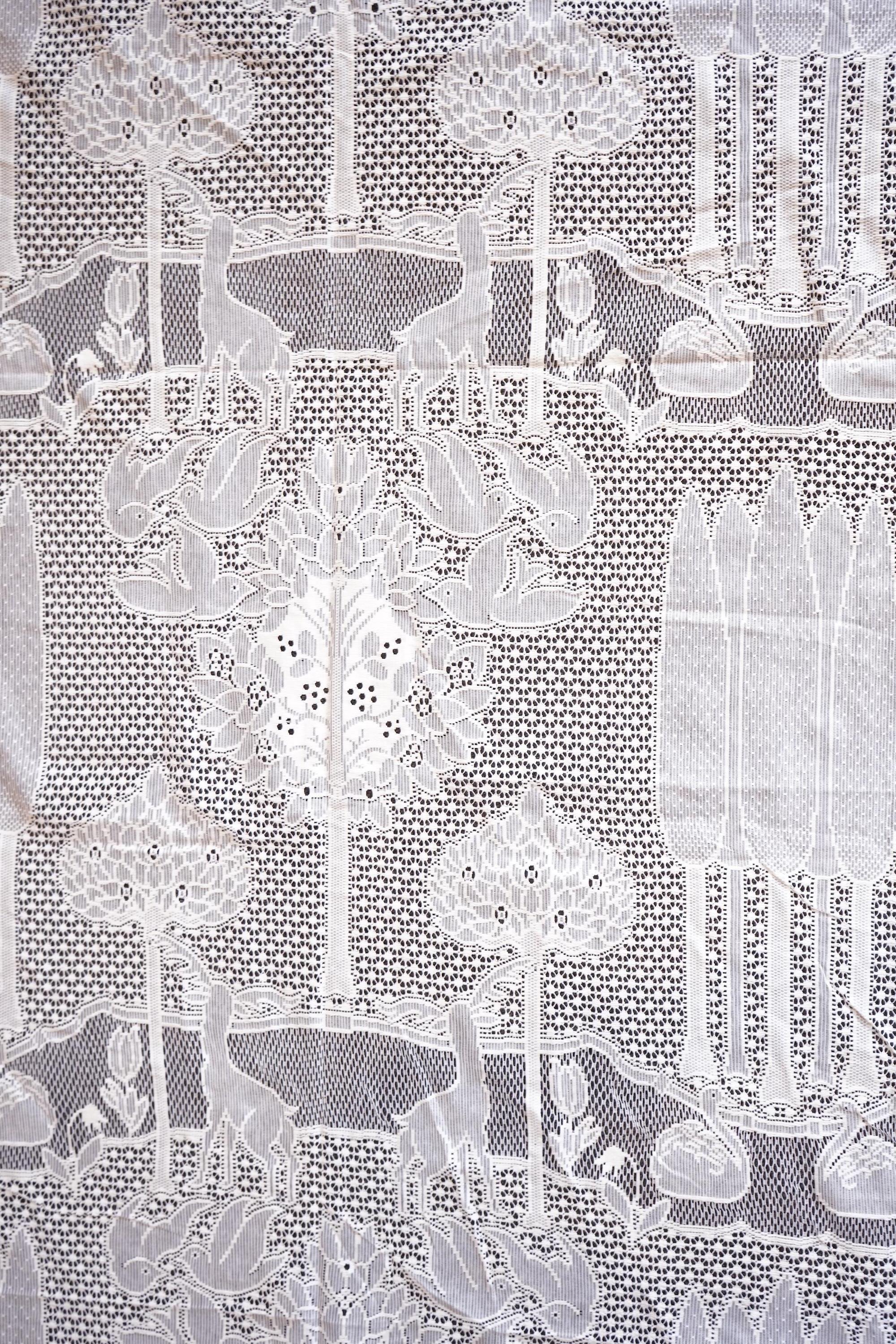 A single C.F.A. Voysey machine lace curtain ‘The Stag’ design, manufactured by Rose’s Mill Ltd, Ayrshire, Scotland. 180cm wide x 240cm long. Condition - unused.